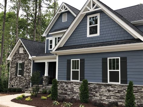 blue metal roof on grey house|gray house with dark trim.